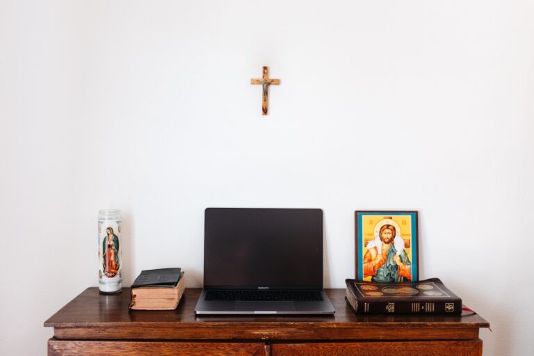 Church staff planning a WordPress website on a laptop in a bright community space